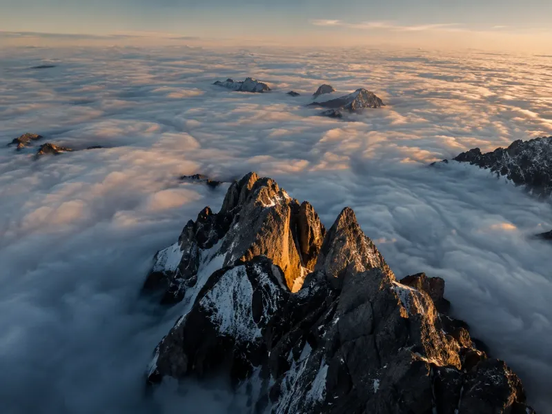 Mountain Peaks Rising Above a Sea of Clouds wallpaper preview